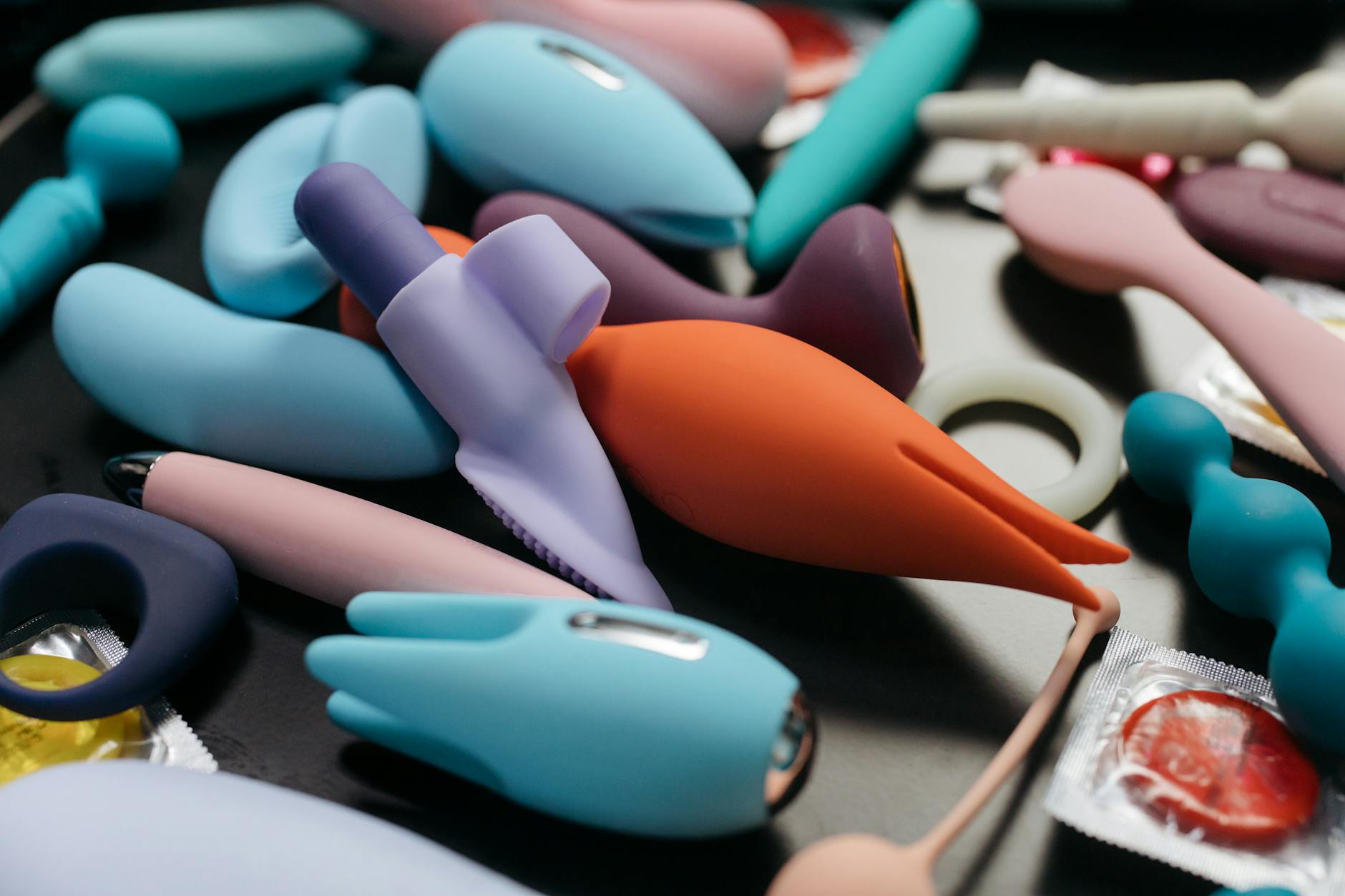 Hands holding a sleek lemon vibrator against a purple background, symbolizing reclaiming personal pleasure and autonomy.